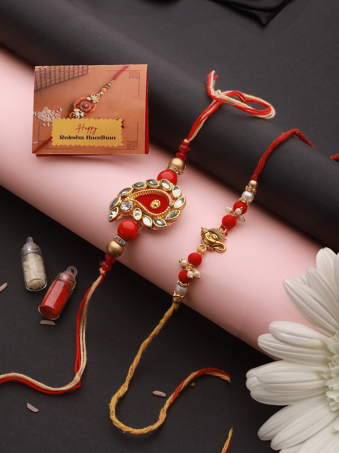 

Saraf RS Jewellery Set Of 2 Ganesha & Carry Thread Rakhis with Roli Chawal & Greeting Card, Red