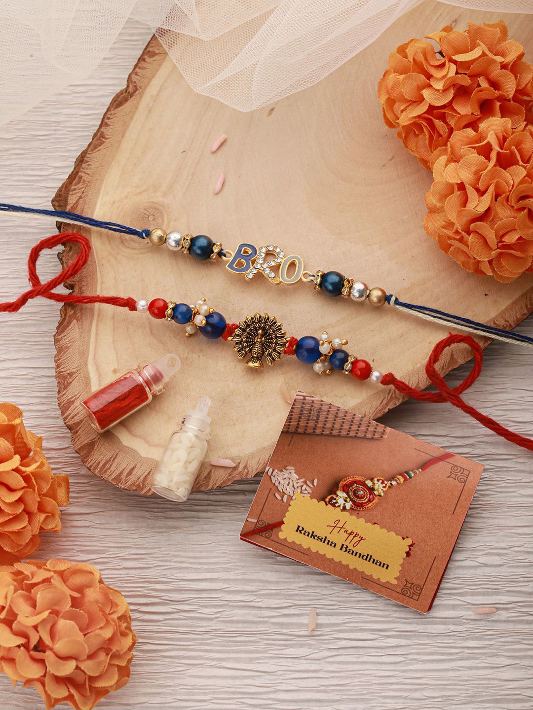

Saraf RS Jewellery Set Of 2 Crystal Studded Rakhi With Tilak Chawal & Greeting Card, Navy blue