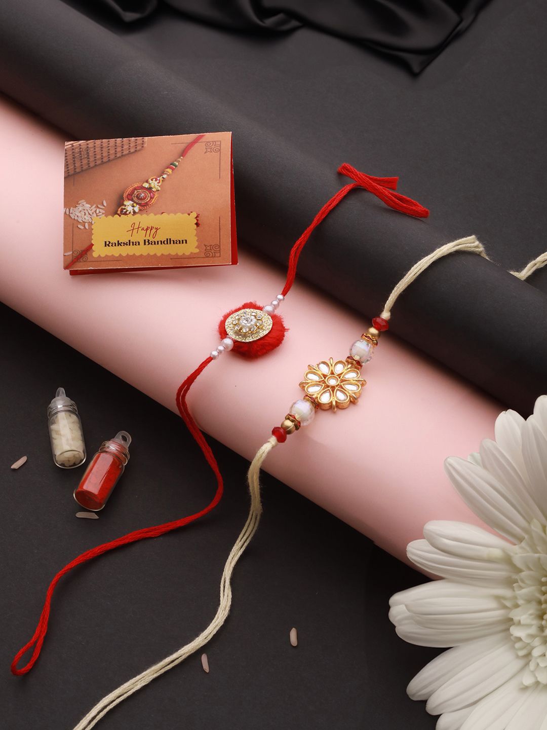 

Saraf RS Jewellery Set Of 2 Kundan Studded Rakhi With Roli Tilak & Greeting Card, Red