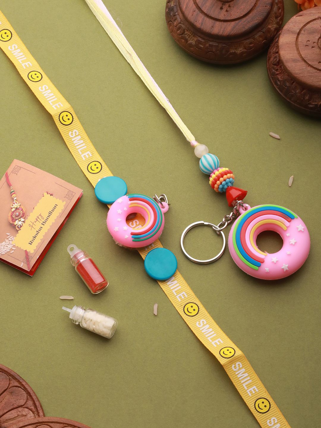 

Saraf RS Jewellery Set Of 2 Donut Key Chain Toy Rakhis with Roli Chawal & Greeting Card, Blue