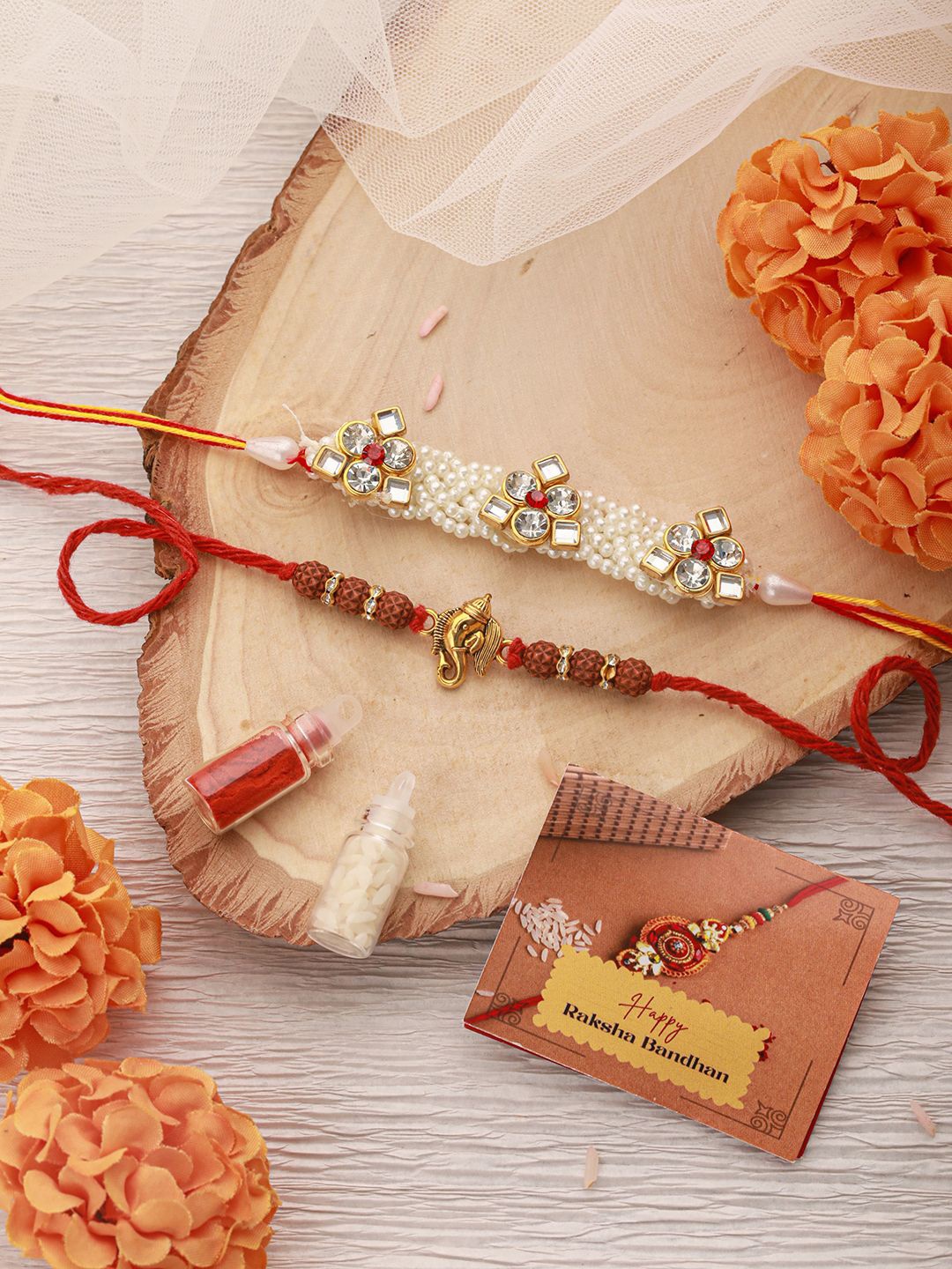 

Saraf RS Jewellery Set Of 2 Ganesh Rudraksh Rakhis With Roli Chawal & Greeting Card, Red