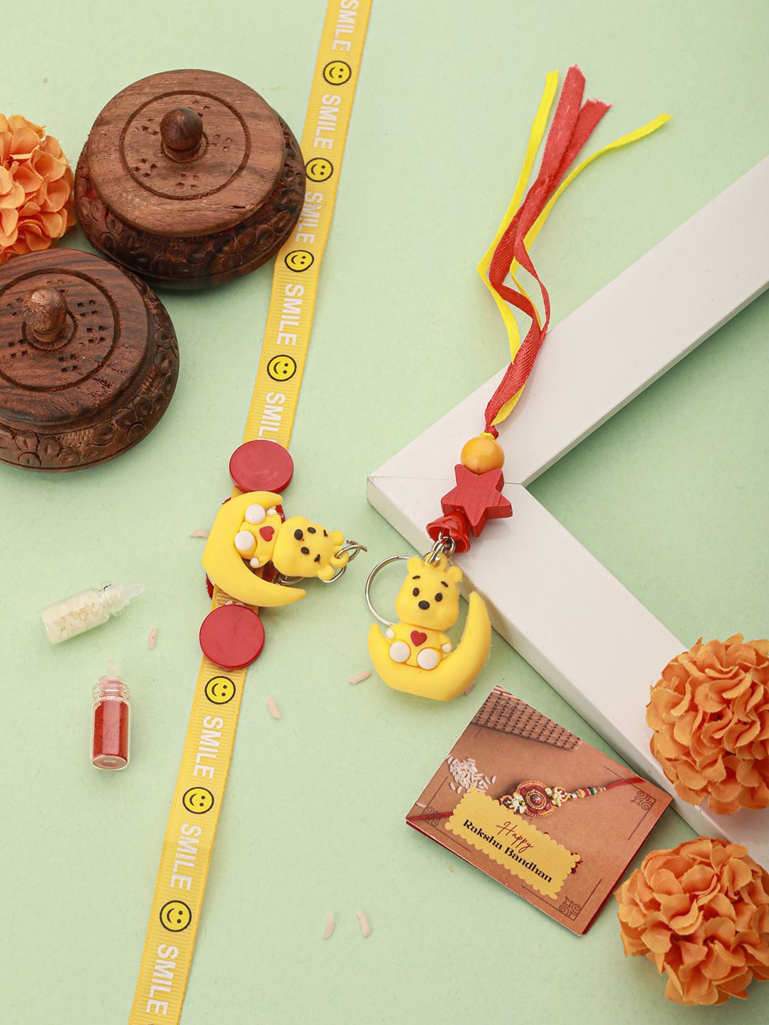 

Saraf RS Jewellery Set Of 2 Winnie The Pooh Rakhi With Roli Chawal & Greeting Card, Yellow