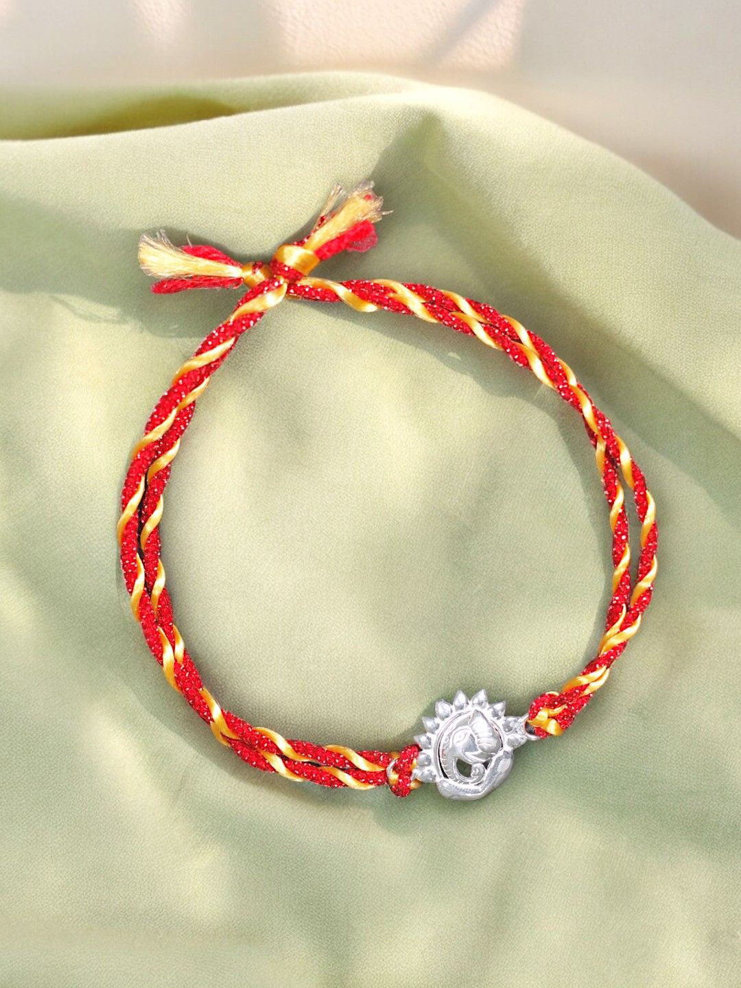 

Taraash 925 Sterling Silver Lord Ganpati Motif Thread Rakhi