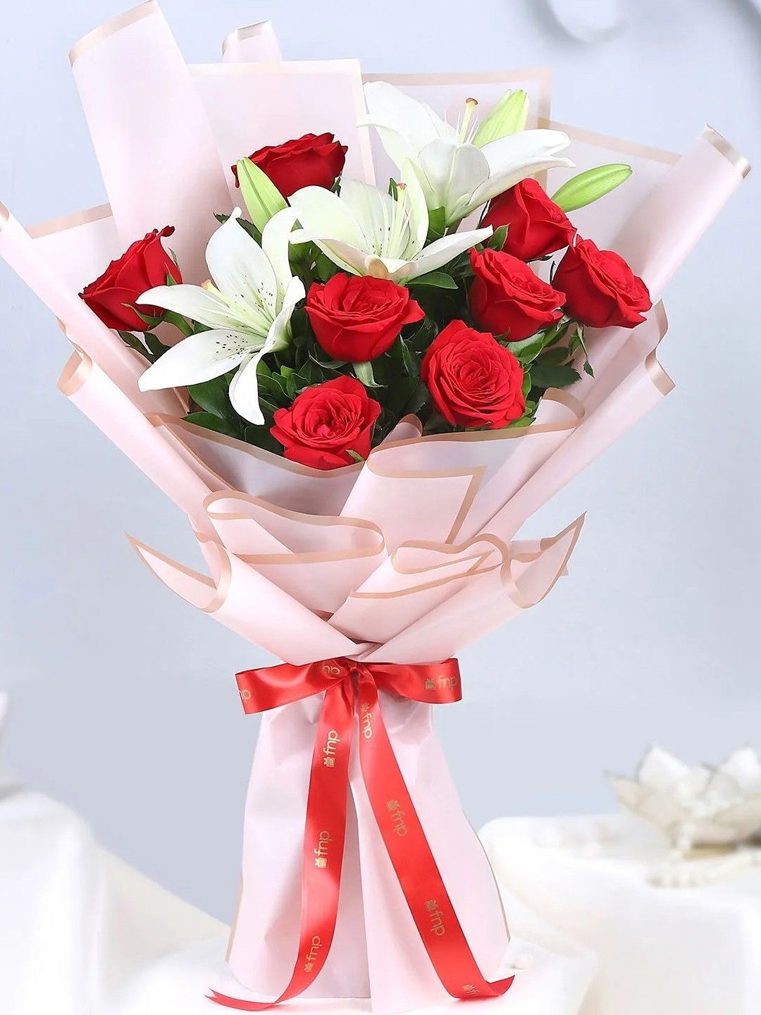 

fnp Red & White 11 Pieces Lily & Crimson Flower Bouquet