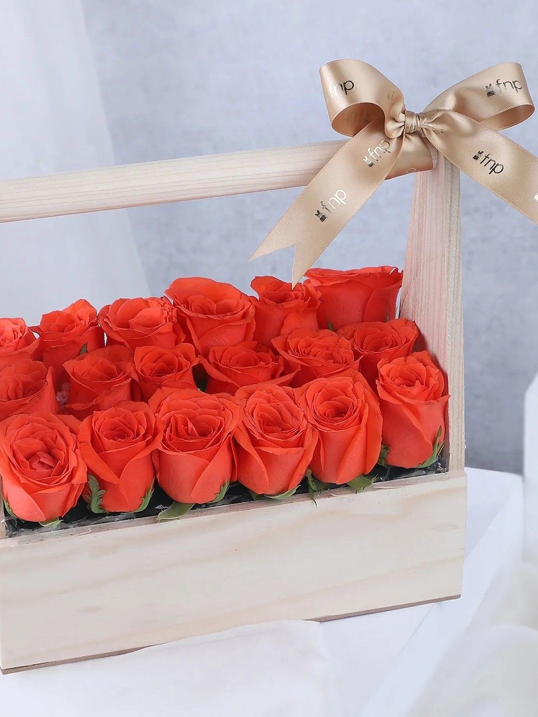 

fnp Premium 18 pieces Orange Coloured Roses Arrangements In Box, Red