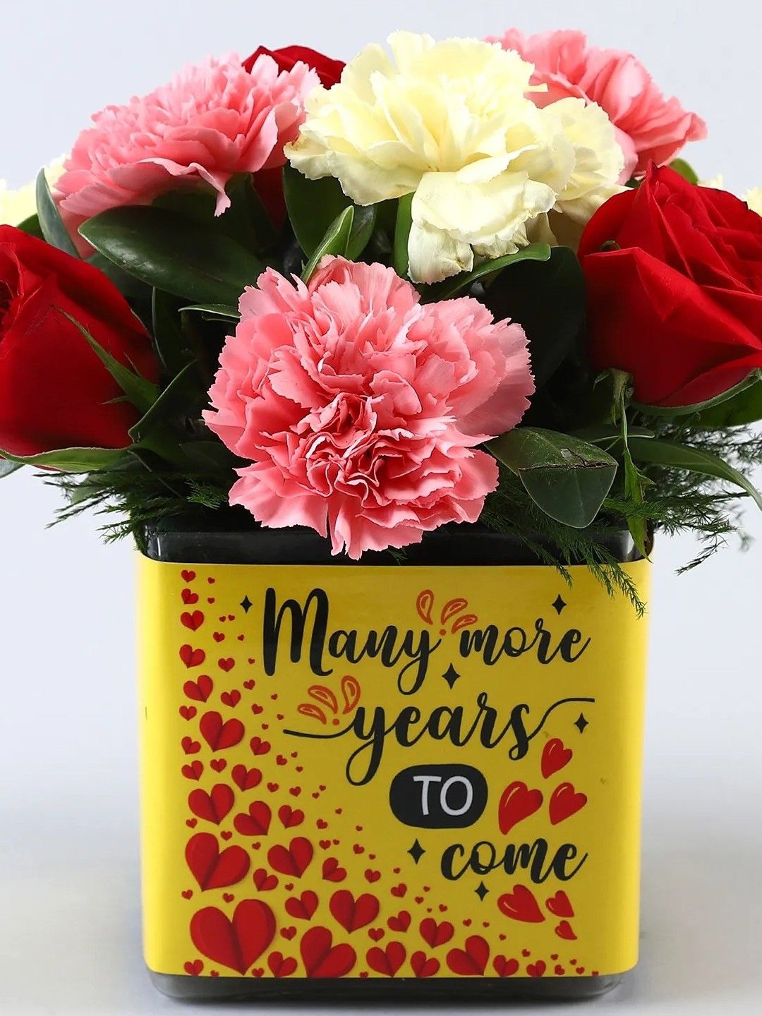 

fnp 4- Pcs Red Rose 3 pcs Yellow Carnations 3-Pcs Pink Carnations Fresh Flowers In Vase