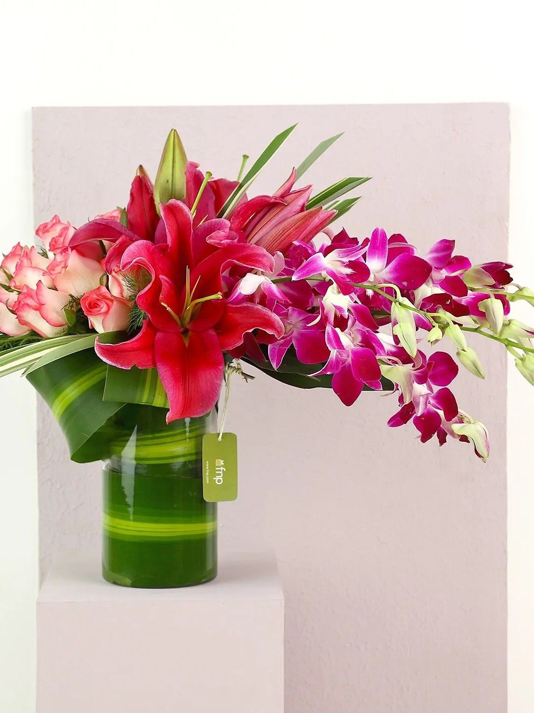 

fnp Purple & Pink 7 Pieces Orchids and Lilies Mixed Fresh Flowers Vase