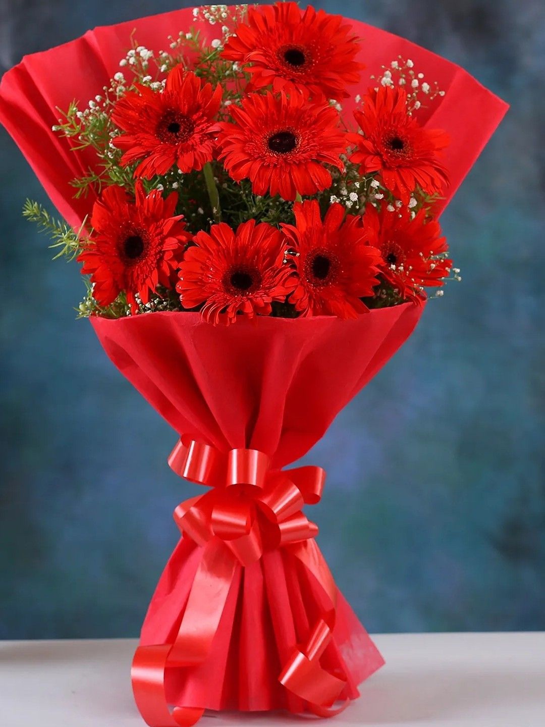 

fnp Red & Green 8 Pieces Gerbera Fresh Flowers Bouquet