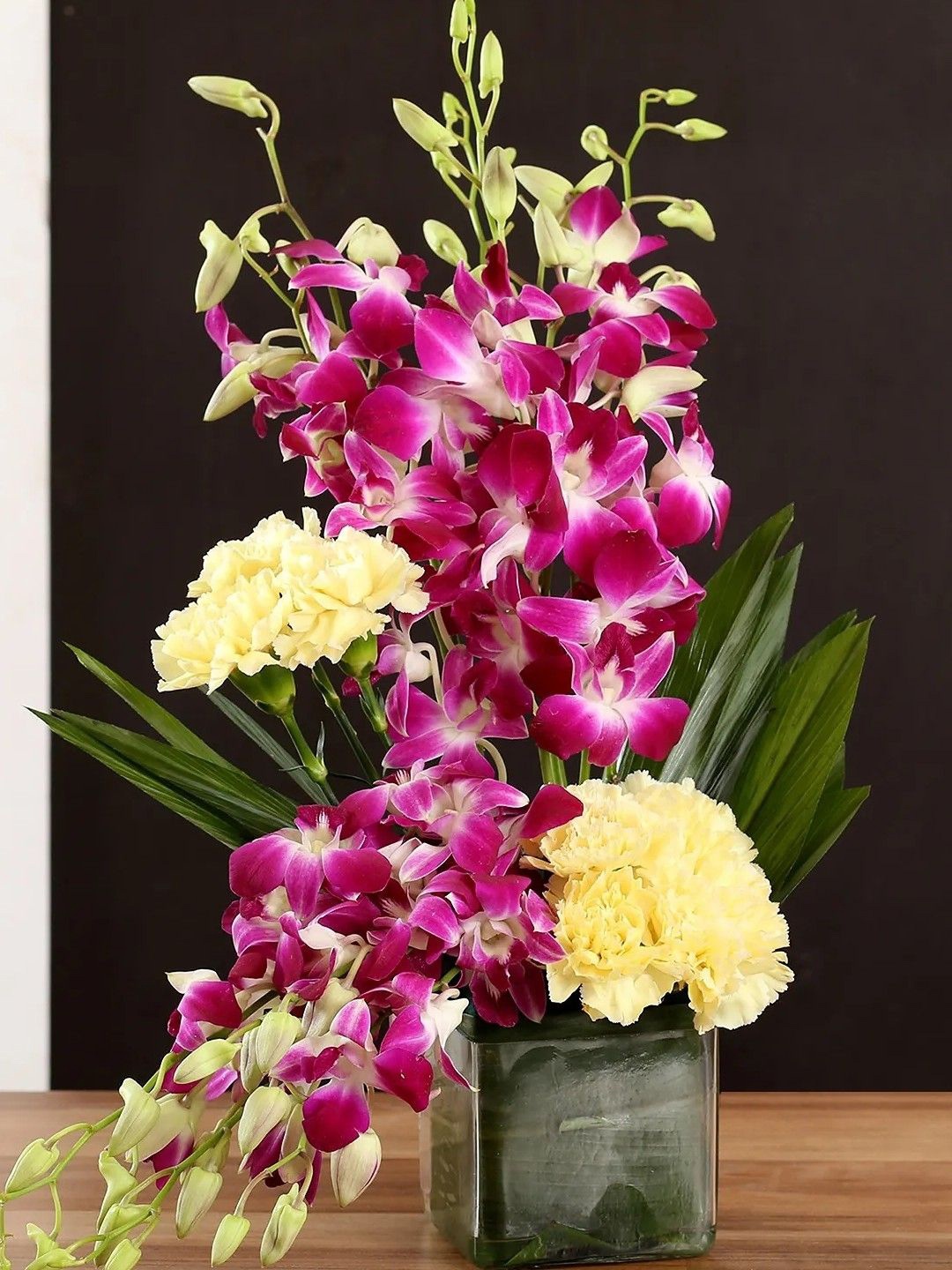 

fnp Yellow & Purple 17 Pieces Carnations & Orchids Fresh Flowers Vase
