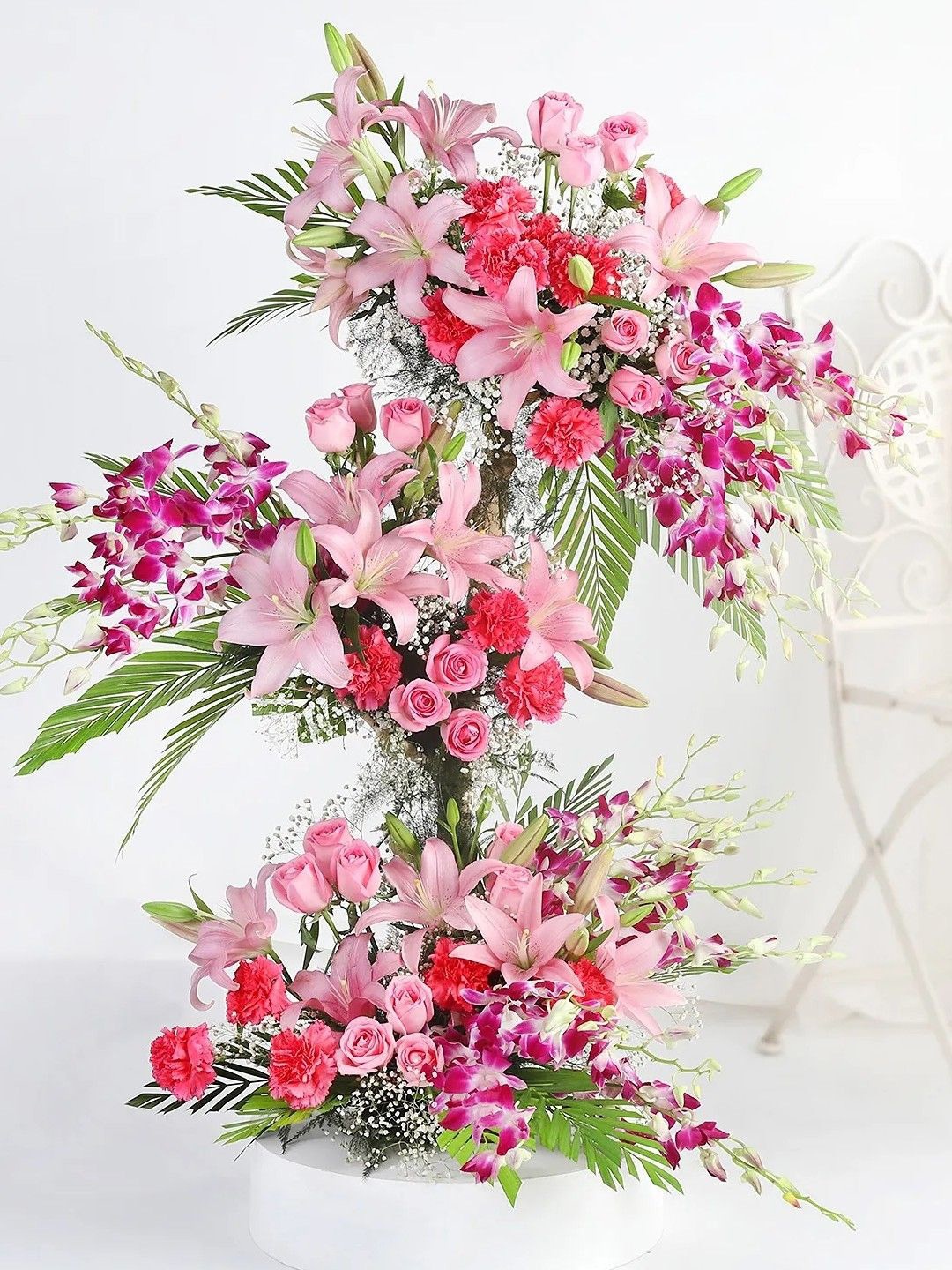 

fnp 63 pieces Pink & Purple Enchanted Garden Floral Arrangement