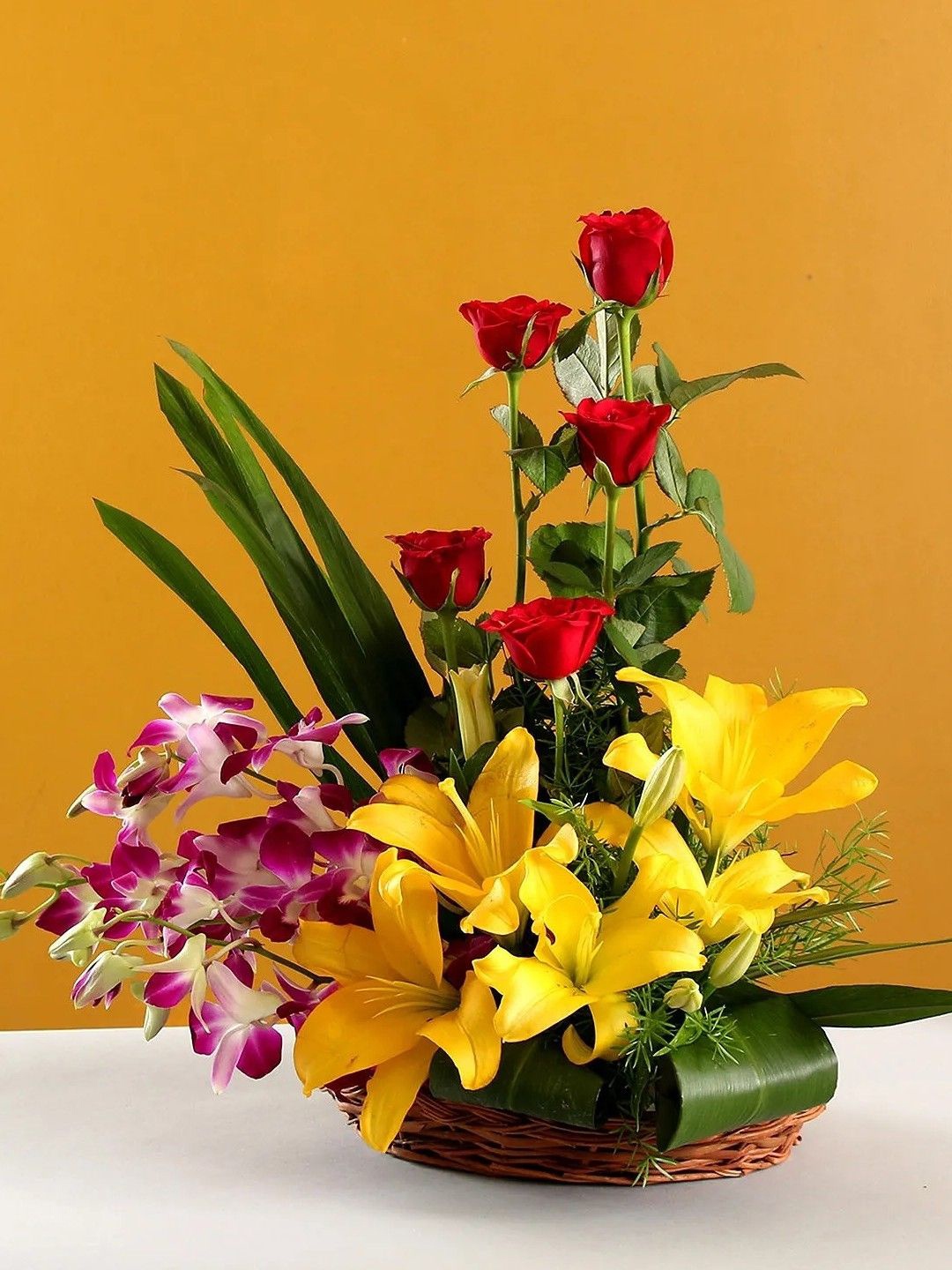 

fnp Red & Yellow 14 Pieces Roses Lilies & Orchids Fresh Flowers Bouquet
