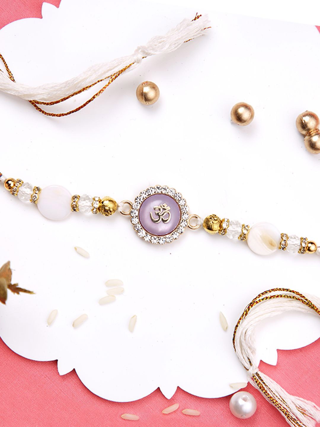 

Aapno Rajasthan Om Beaded Multistrand Rakhi With Roli Chawal & Greetings Card, White