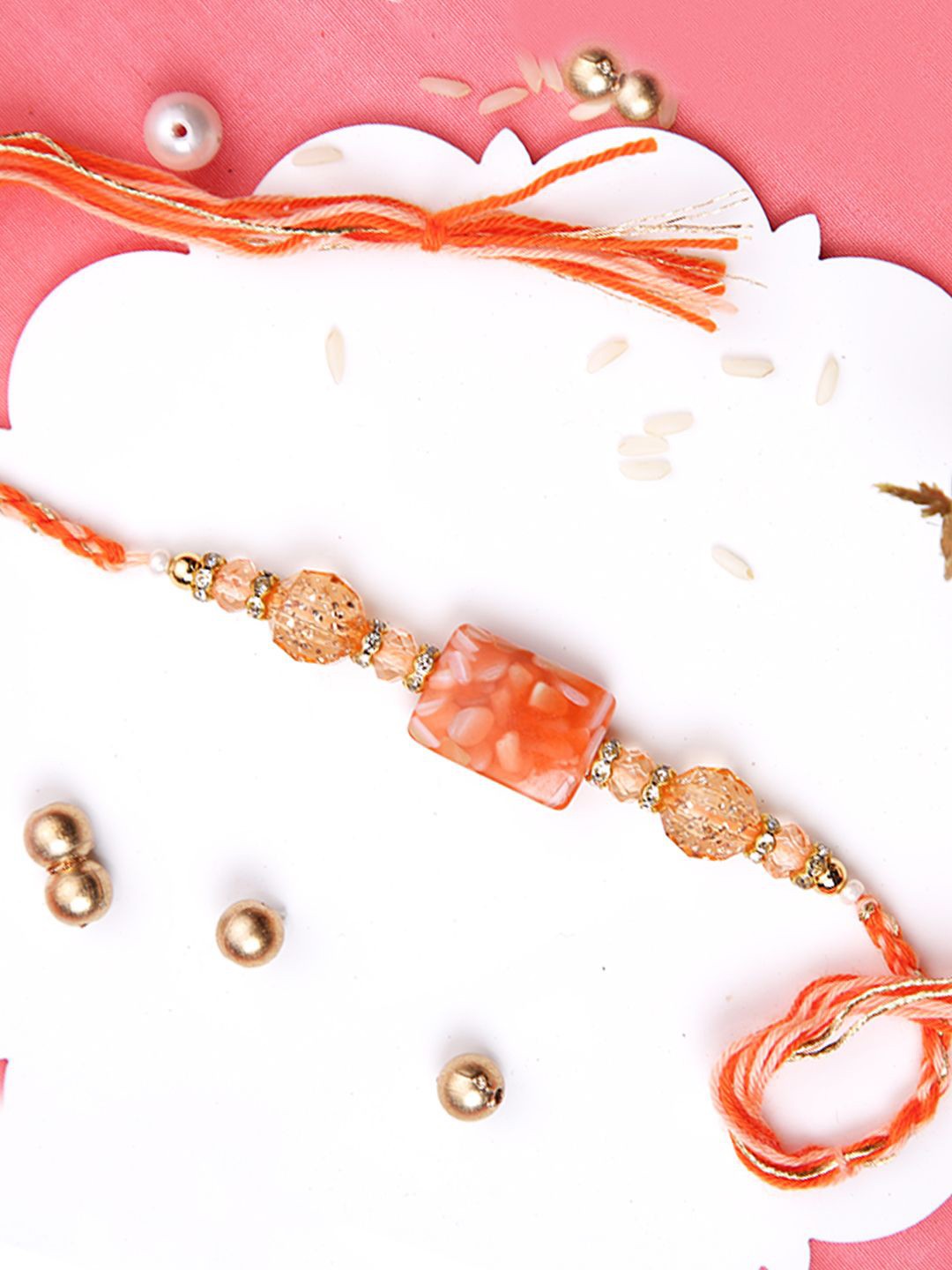 

Aapno Rajasthan Beaded Thread Rakhi with Roli Chawal & Greetings Card, Orange
