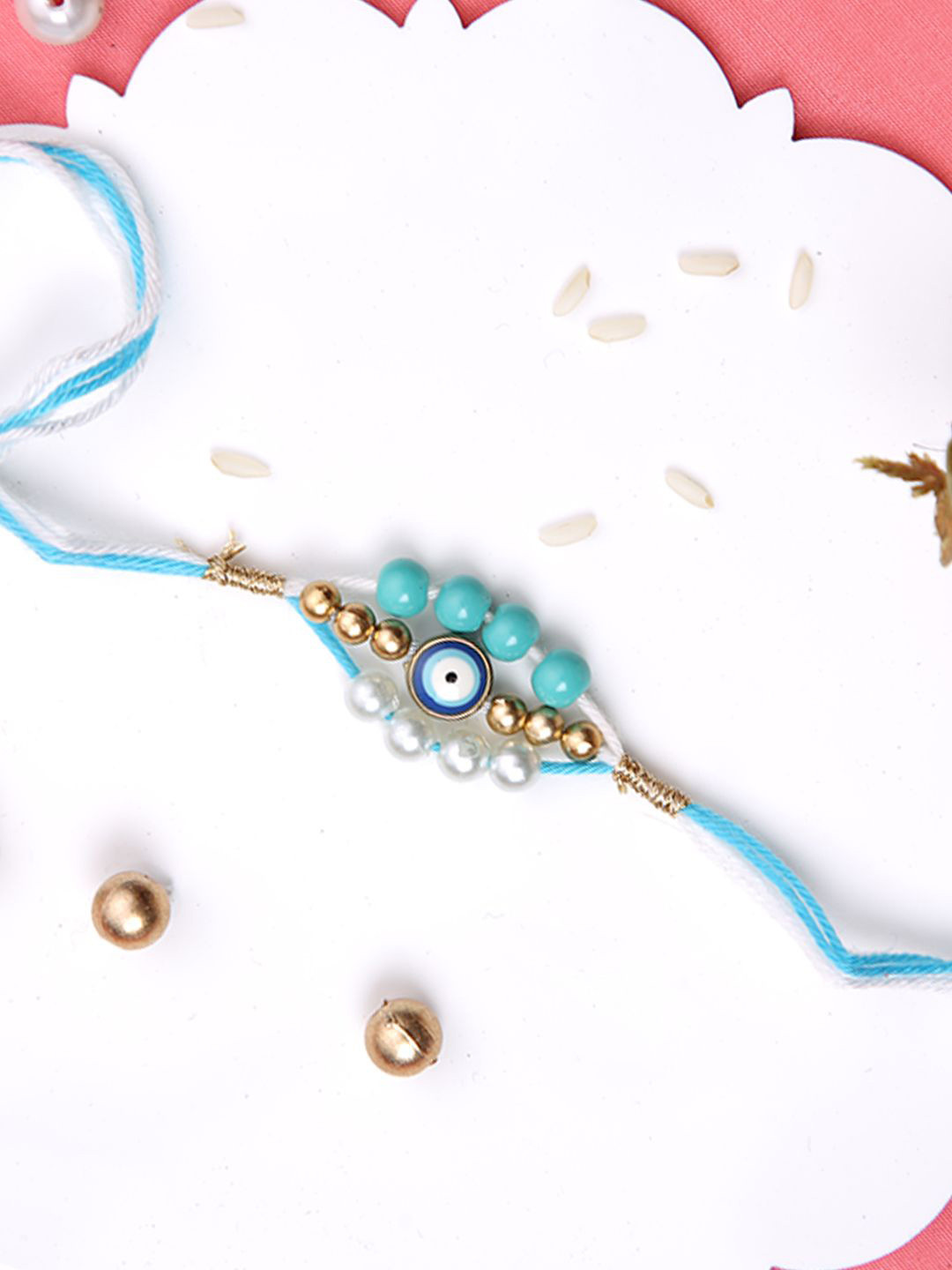 

Aapno Rajasthan Evil Eye Beaded Rakhi With Roli Chawal & Greeting Card, Blue