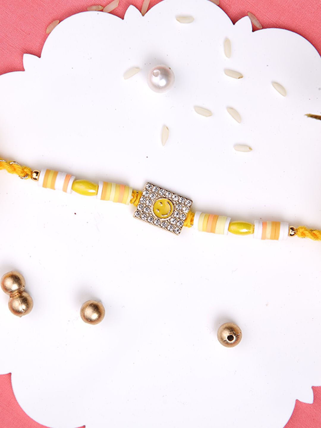 

Aapno Rajasthan Beaded Thread Rakhi with Roli Chawal & Greetings Card, Yellow