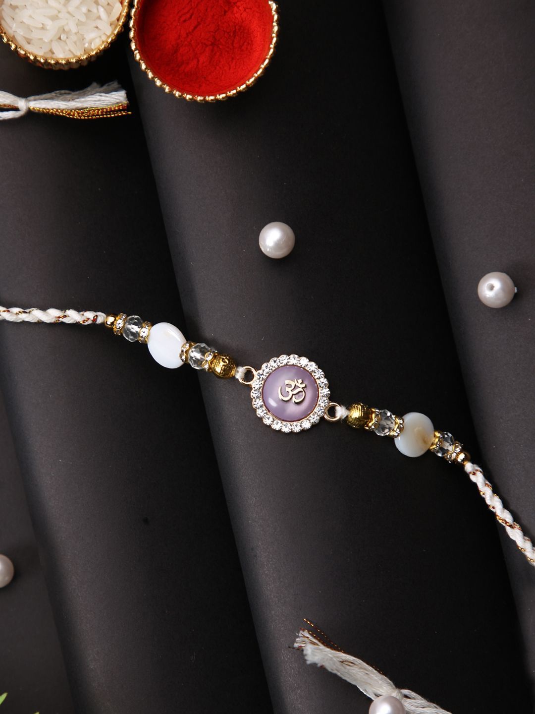 

Aapno Rajasthan Om Beaded Multistrand Rakhi With Roli Chawal & Greetings Card, White
