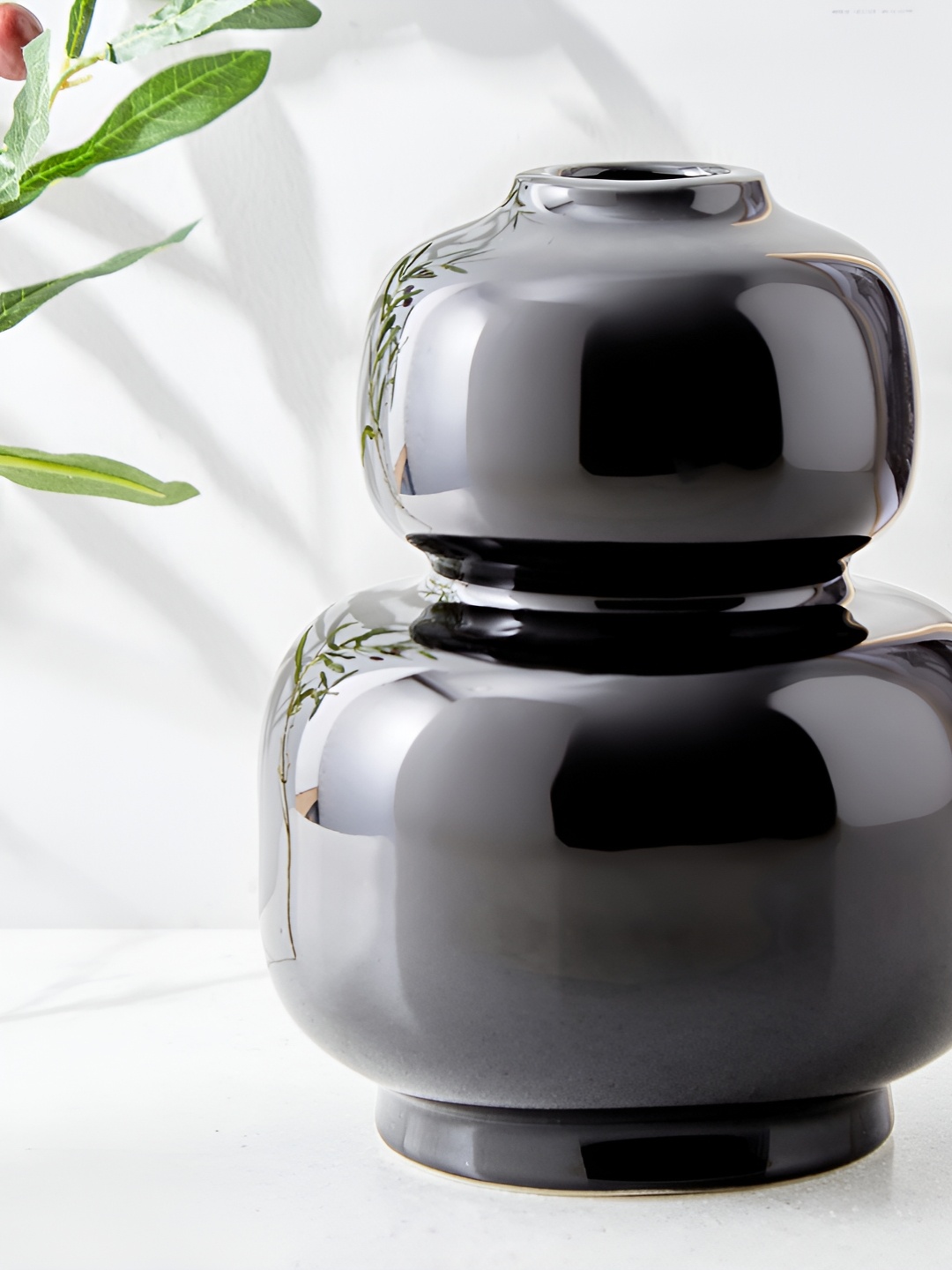 

Home Centre Blanco Black Ceramic Curved Vase