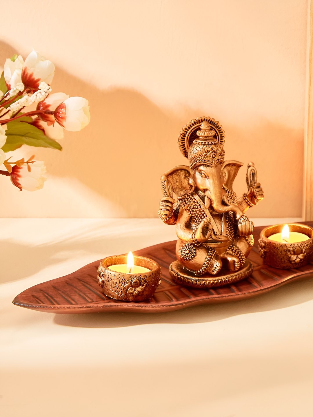 

Home Centre Renaissance Gold-Toned 4 Pieces Textured Ganesha Figurine With T-Light Holders