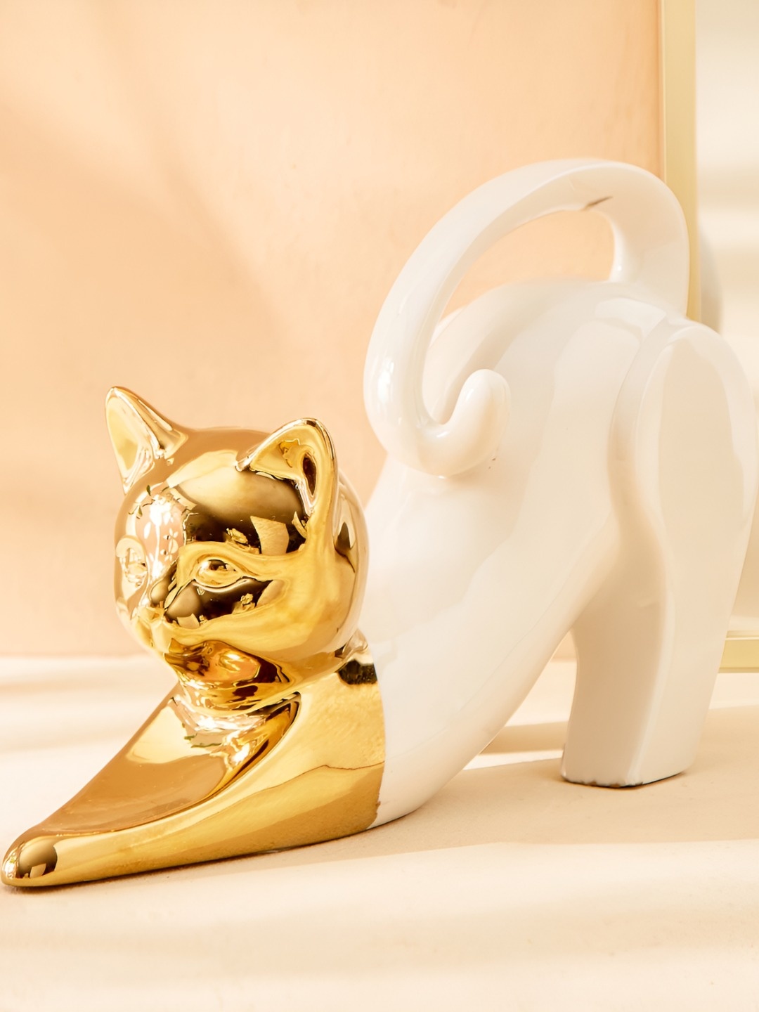 

Home Centre White Ceramic Stretching Cat Figurine Showpiece