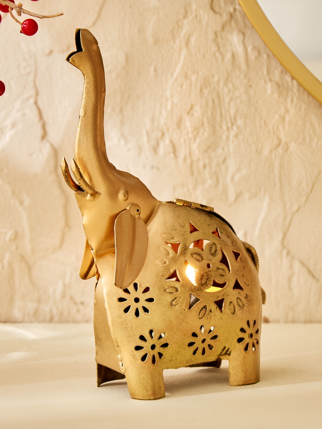 

Home Centre Corsica Gold-Toned Textured Iron Elephant T-Light Holder