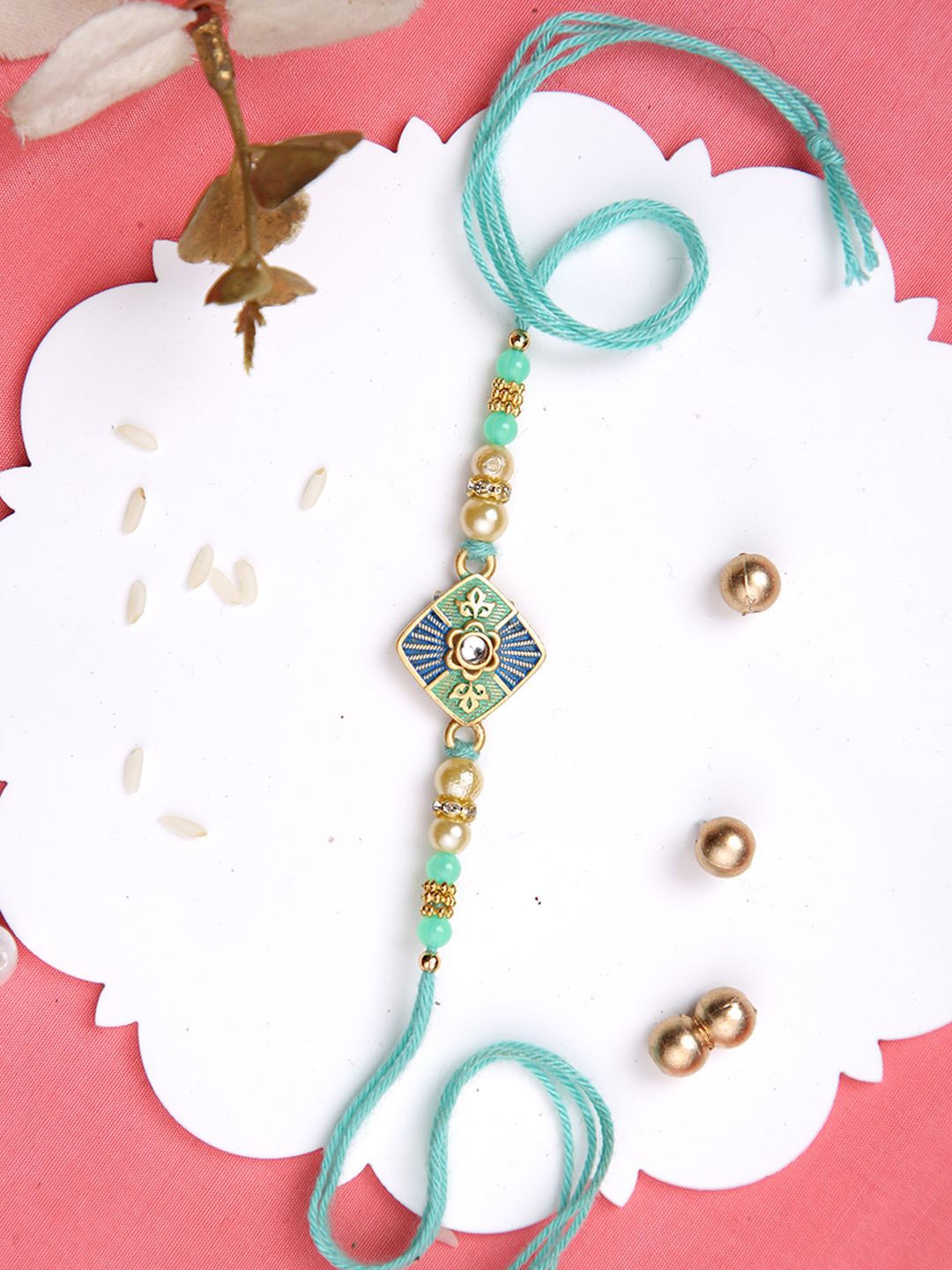 

Aapno Rajasthan Beaded & Stone Studded Rakhi With Roli Chawal & Greeting Card, Blue