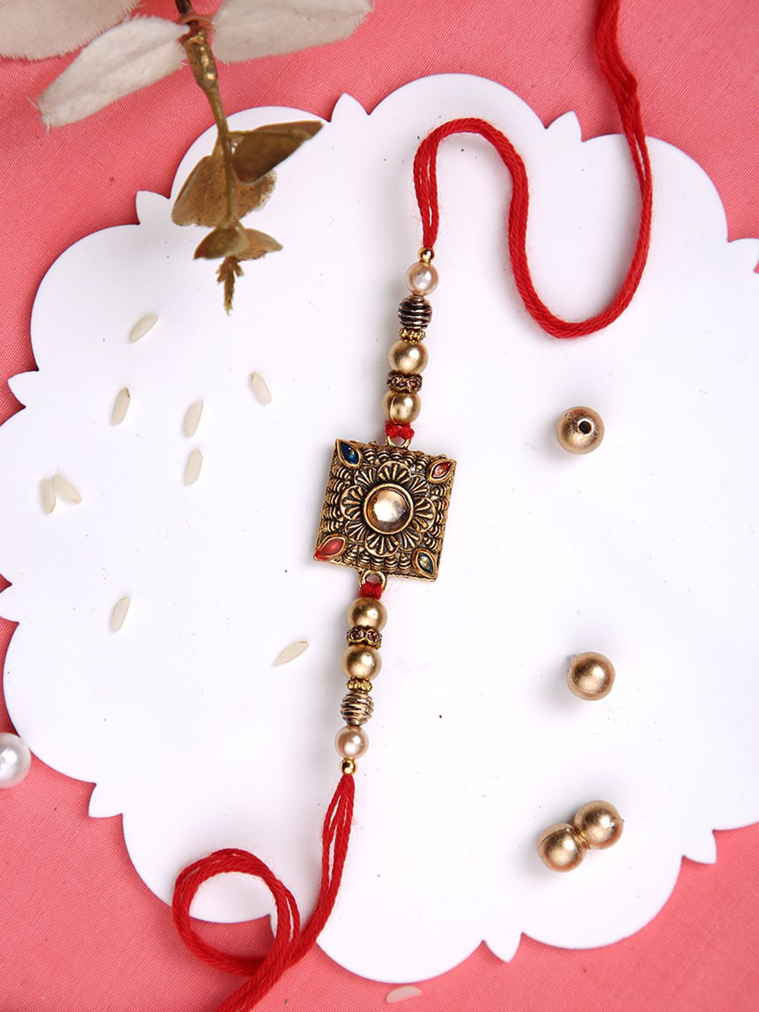 

Aapno Rajasthan Antique Kundan & Beads Multistrand Rakhi With Roli Chawal & Greetings Card, Gold