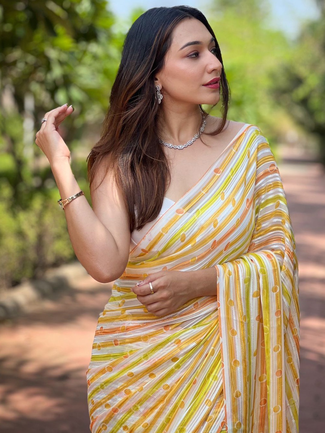 

Vastrasky Global Striped Poly Georgette Saree, Yellow