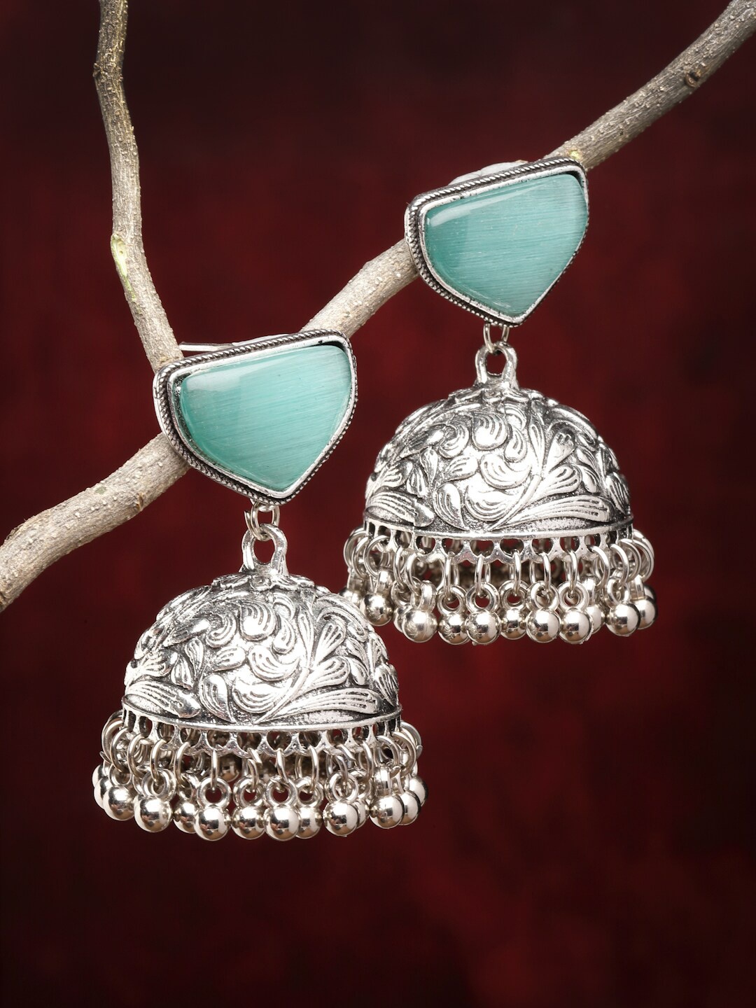 

Sanjog Silver-Plated German Silver Contemporary Oxidised Artificial Stones Jhumka Earrings, Sea green