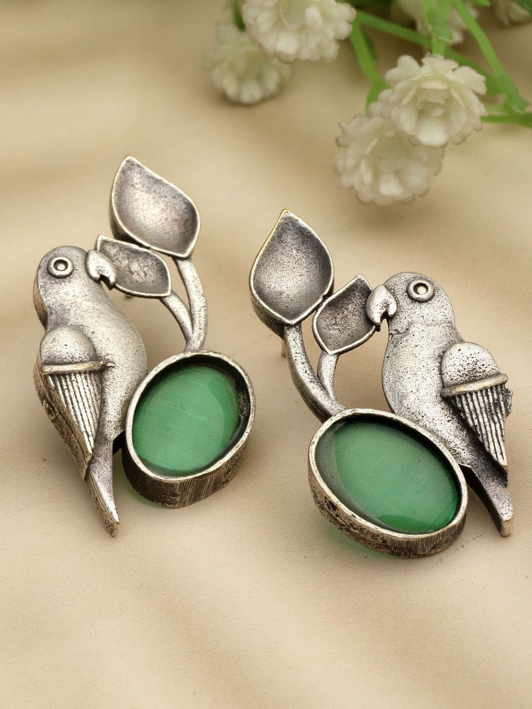 

Sanjog Silver-Plated German Silver Contemporary Oxidised Artificial Stones Stud Earrings