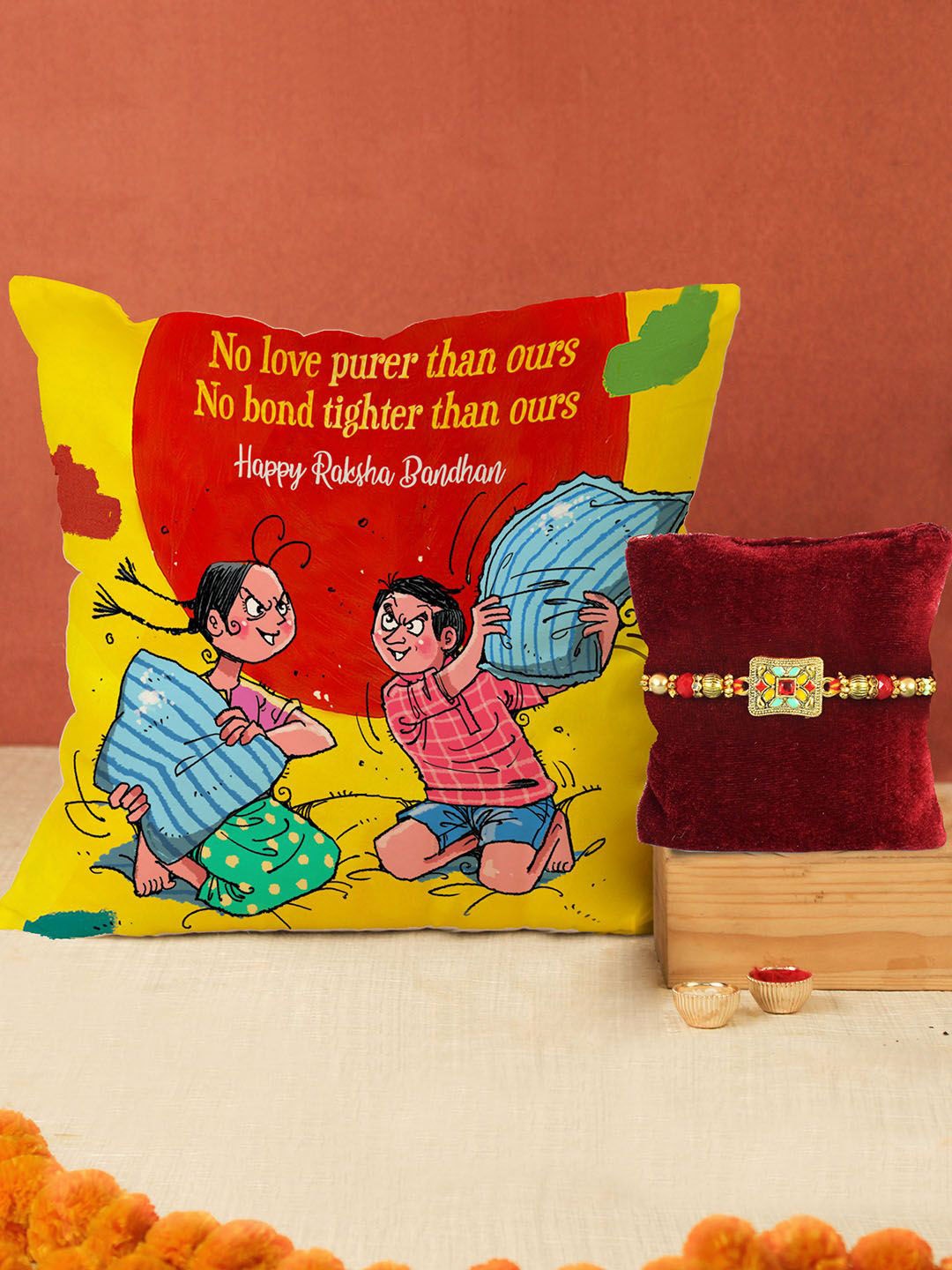 

Tied Ribbons Rakhi, Cushion, Greeting Card & Roli Chawal Gift Set, Gold
