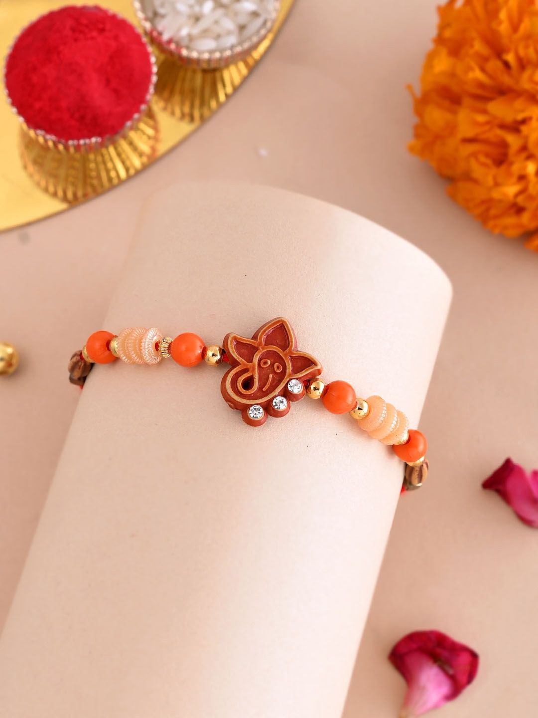 

Aapno Rajasthan Beaded Divine Motif Rakhi With Roli Chawal & Greeting Card, Red