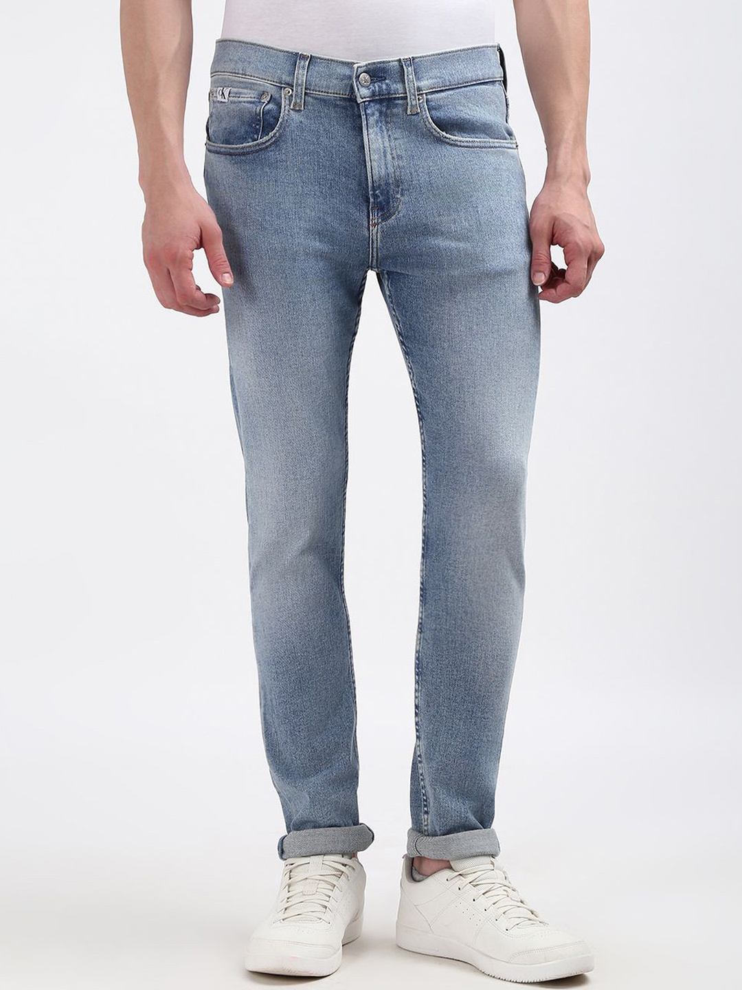 

Calvin Klein Men Mid-Rise Cotton Skinny Fit Low Distress Light Fade Jeans, Blue