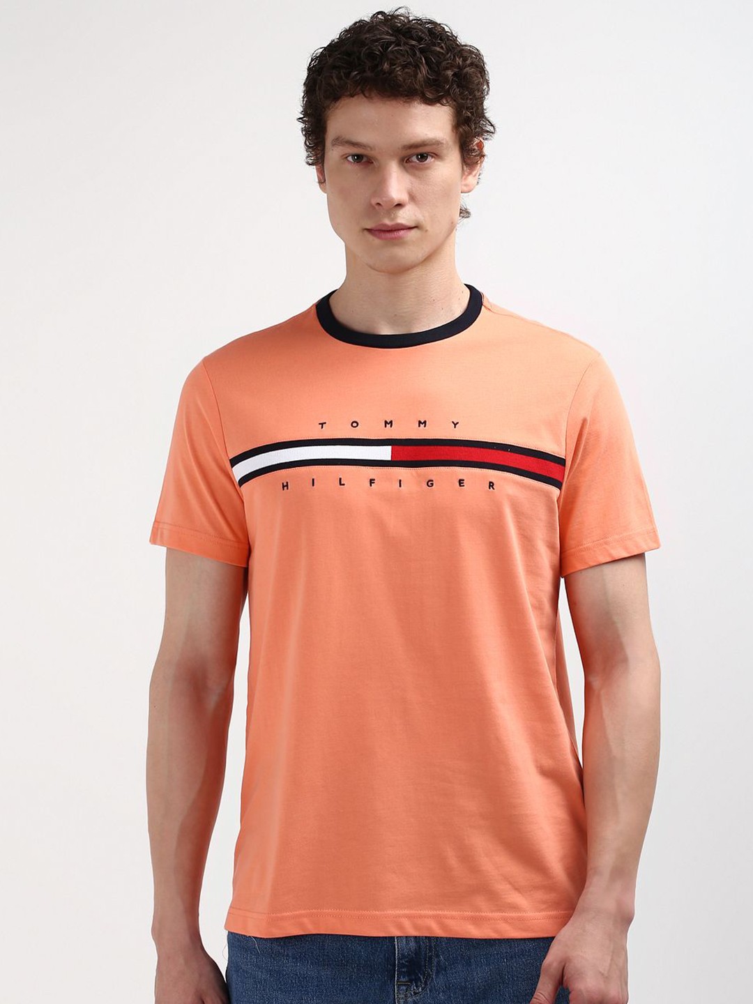 

Tommy Hilfiger Men Solid Round Neck Pure Cotton T-shirt, Peach