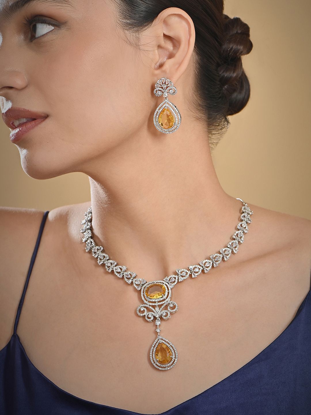 

Fida Silver-Plated American Diamond Stone-Studded Details Necklace and Earrings