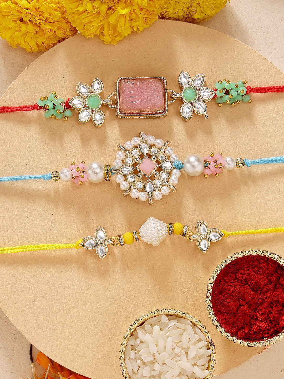 

KARATCART Set of 3 Pink Carved Stone Kundan Rakhis with Roli & Chawal, Red