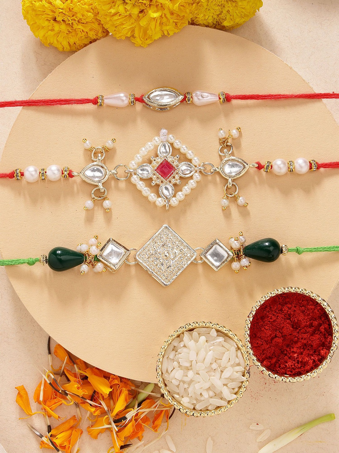 

KARATCART Set of 3 Floral Design Pearl Kundan Rakhis With Roli & Chawal, Red