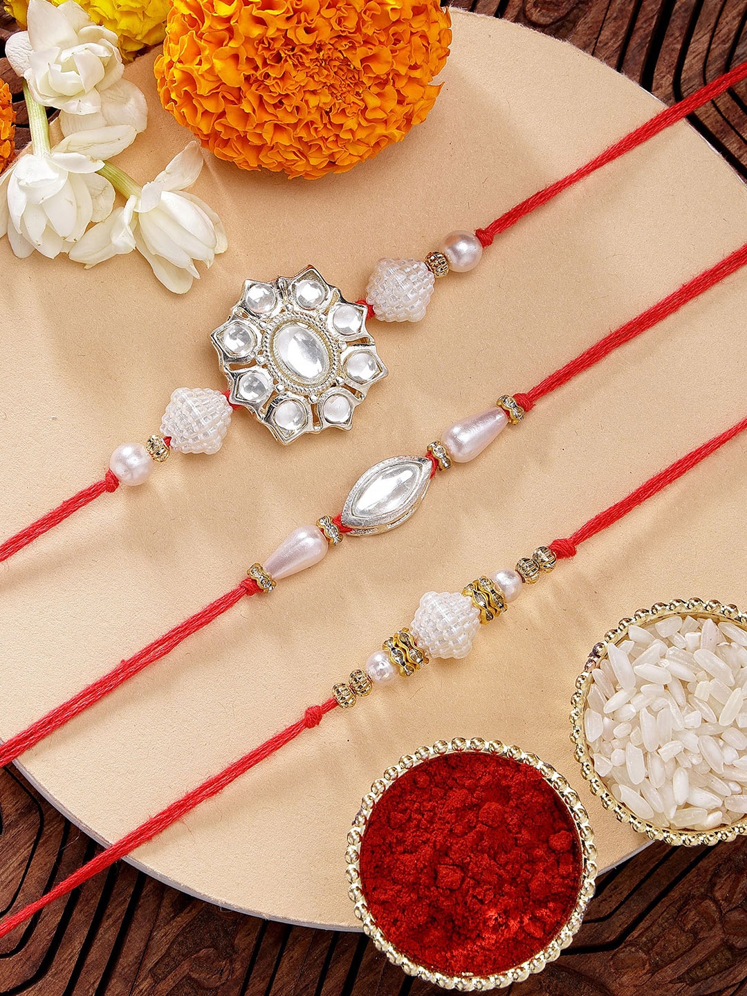 

KARATCART Set of 3 Floral Pearl & Kundan Rakhis with Roli & Chawal, Red