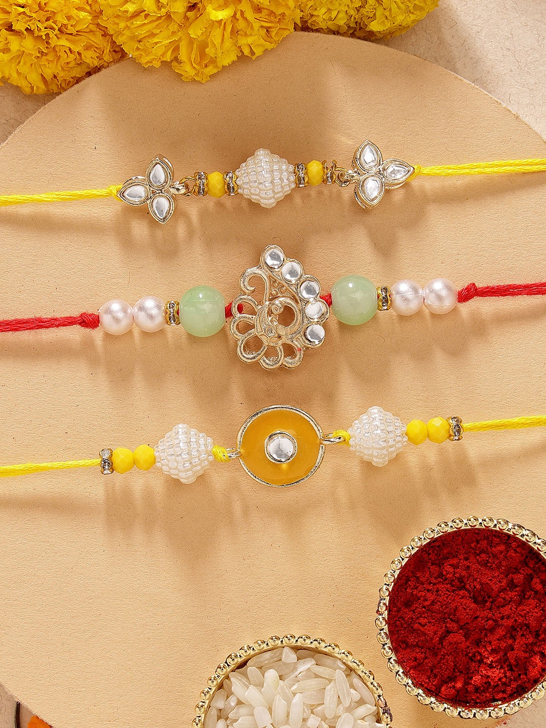 

KARATCART Set of 3 Yellow Meenakari Evil Eye Kundan Rakhis with Roli & Chawal