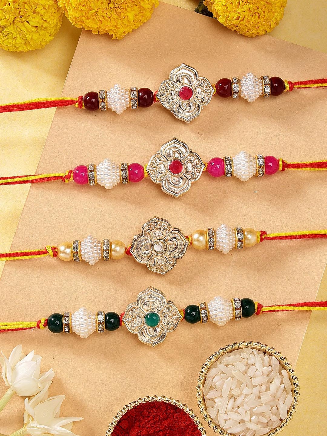 

KARATCART Set of 4 Floral Design Multicolor Kundan Rakhis with Roli & Chawal, Yellow