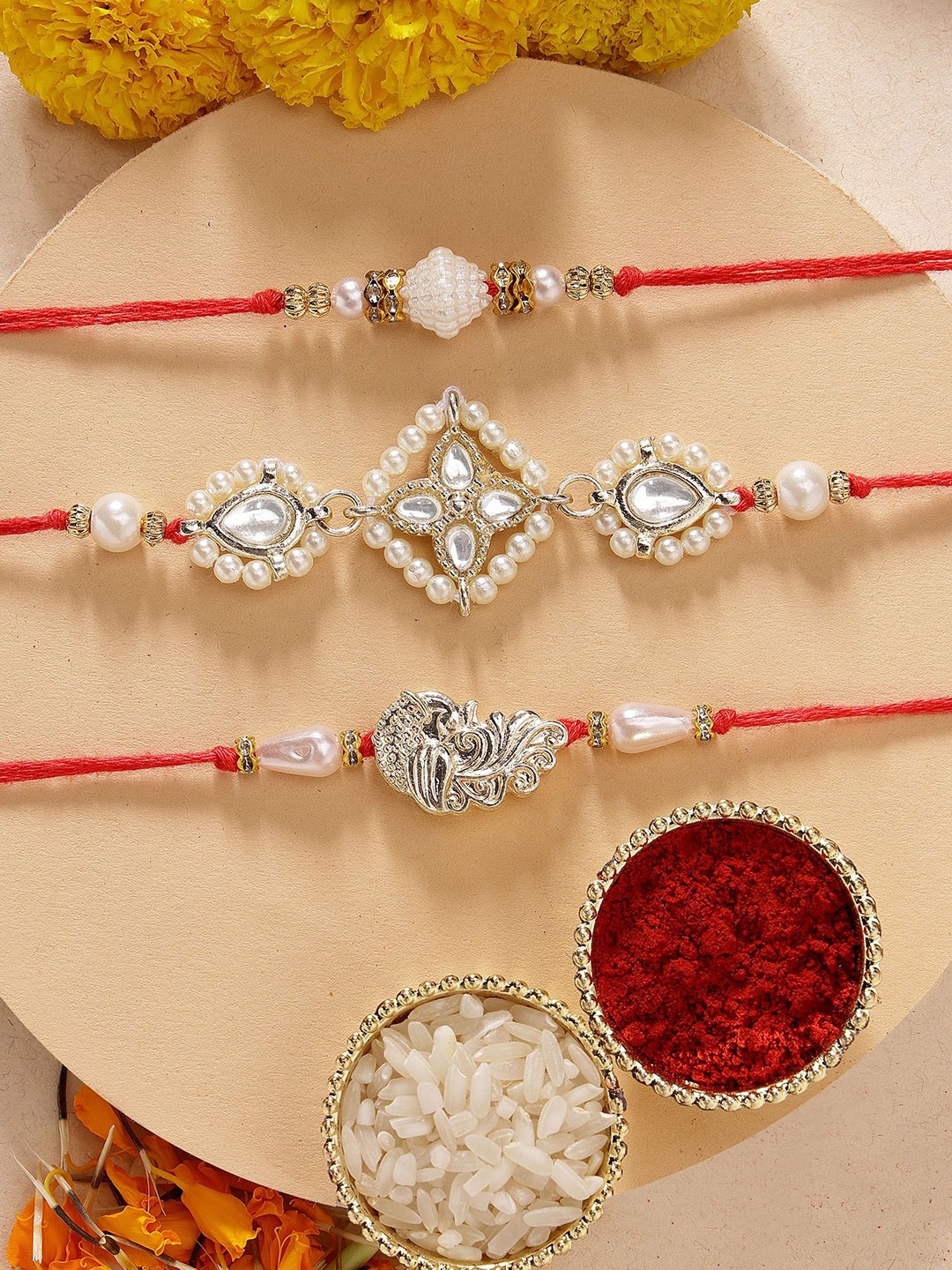 

KARATCART Set of 3 Peacock Design Pearl Kundan Rakhis with Roli & Chawal, Red