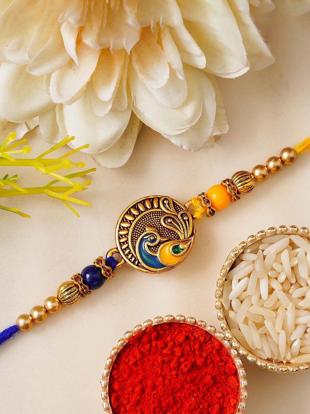 

eCraftIndia Peacock Designer Beaded Rakhi With Roli Chawal, Gold