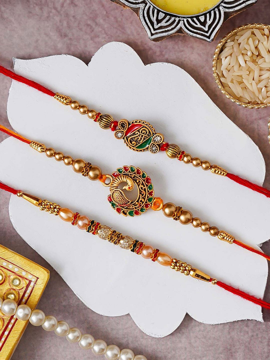 

eCraftIndia Set of 3 Peacock Shri Beads Designer Thread Rakhis with Roli Chawal, Red