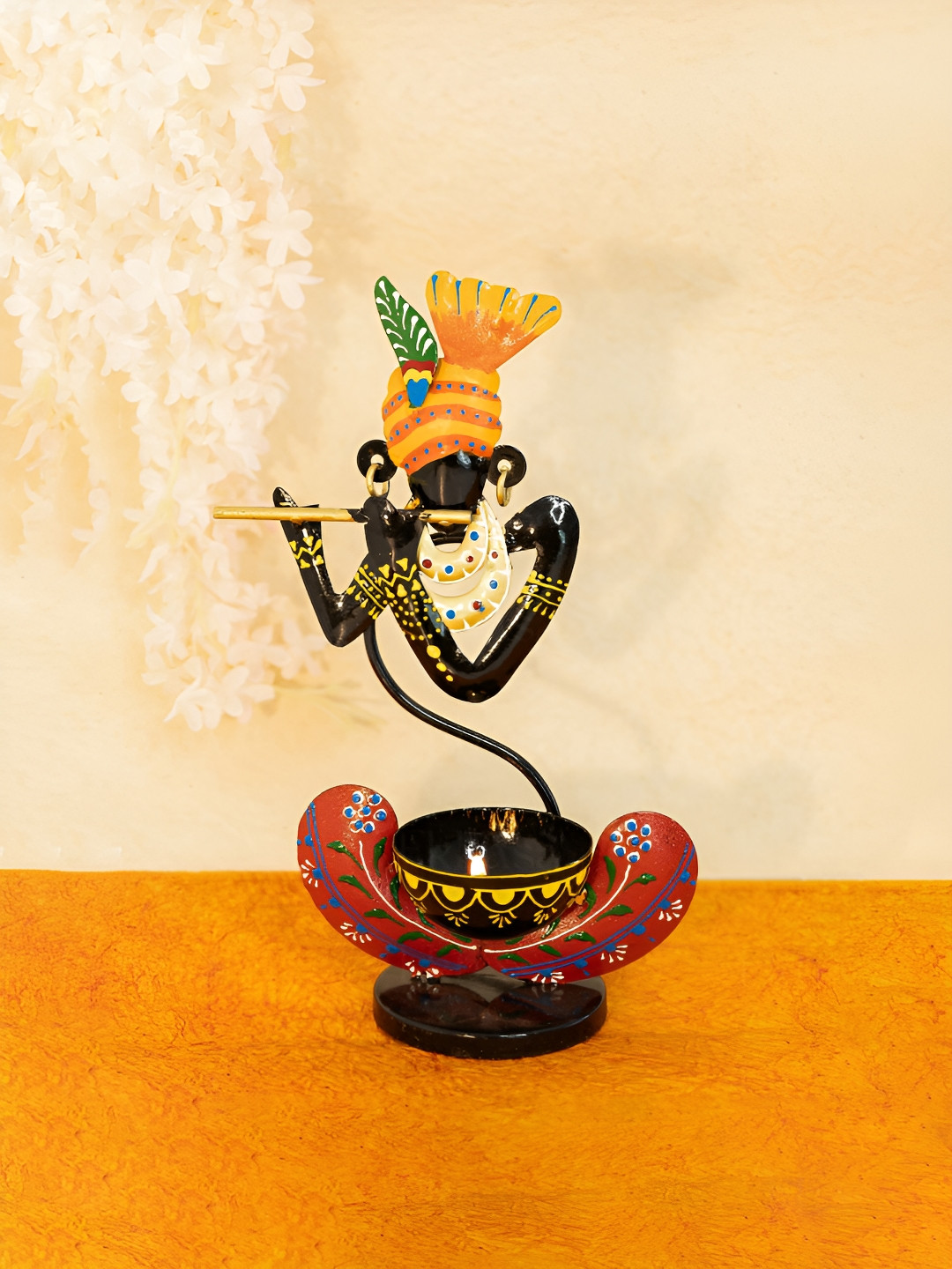 

Ekhasa Black & Yellow Printed Metal Krishna Candle Holder