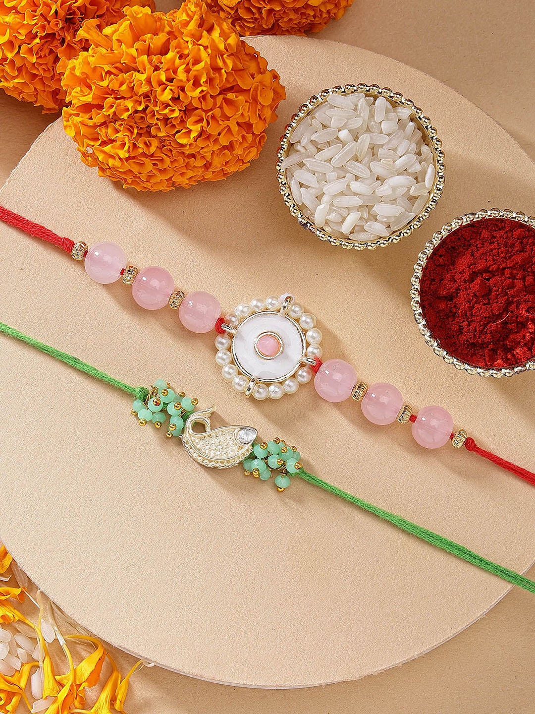 

KARATCART Set of 2 Pink Beads Green Fish Shape Kundan Rakhi with Roli & Chawal