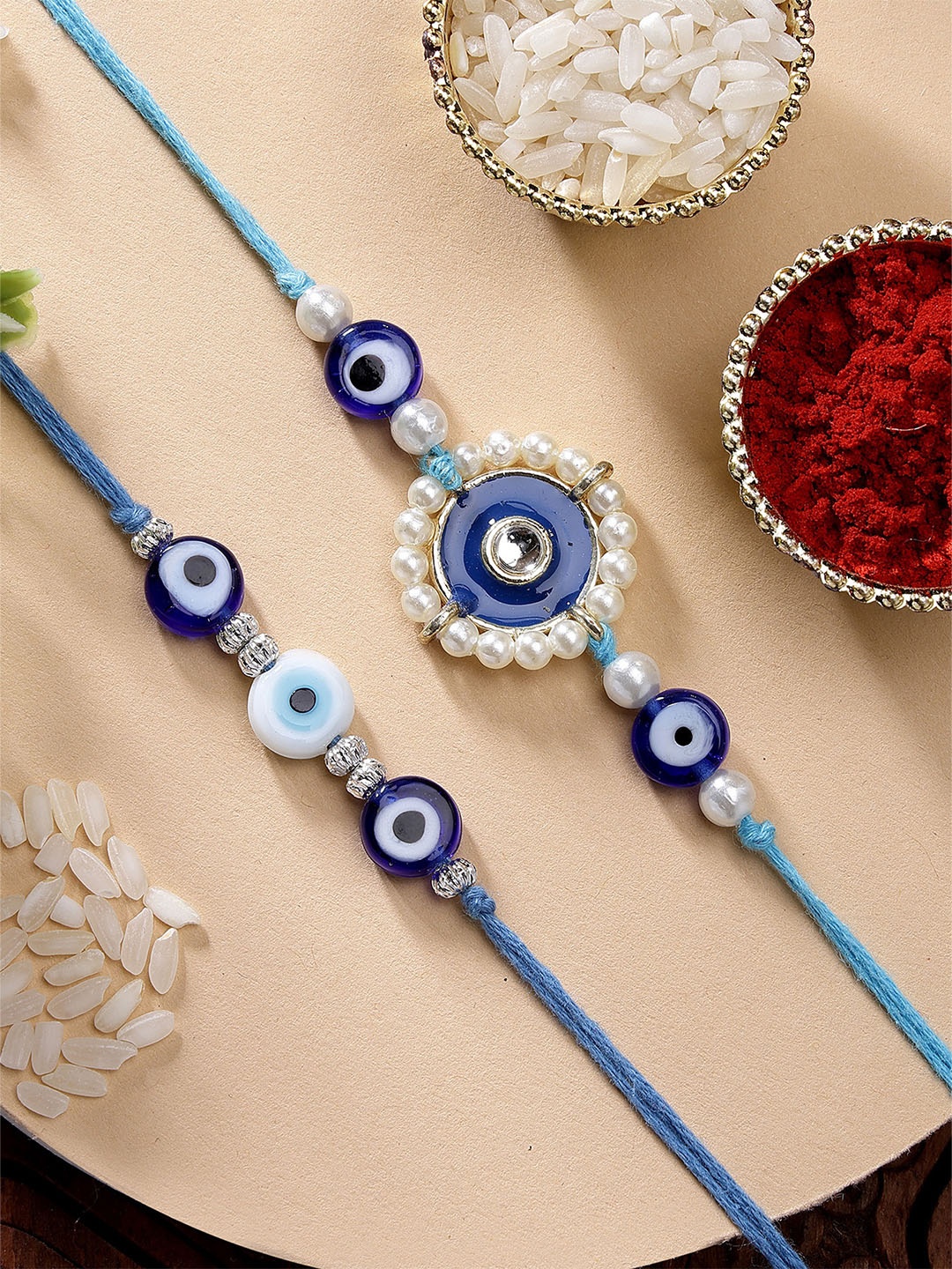 

KARATCART Set of 2 Blue Evil Eye & Pearl Kundan Rakhi with Roli & Chawal
