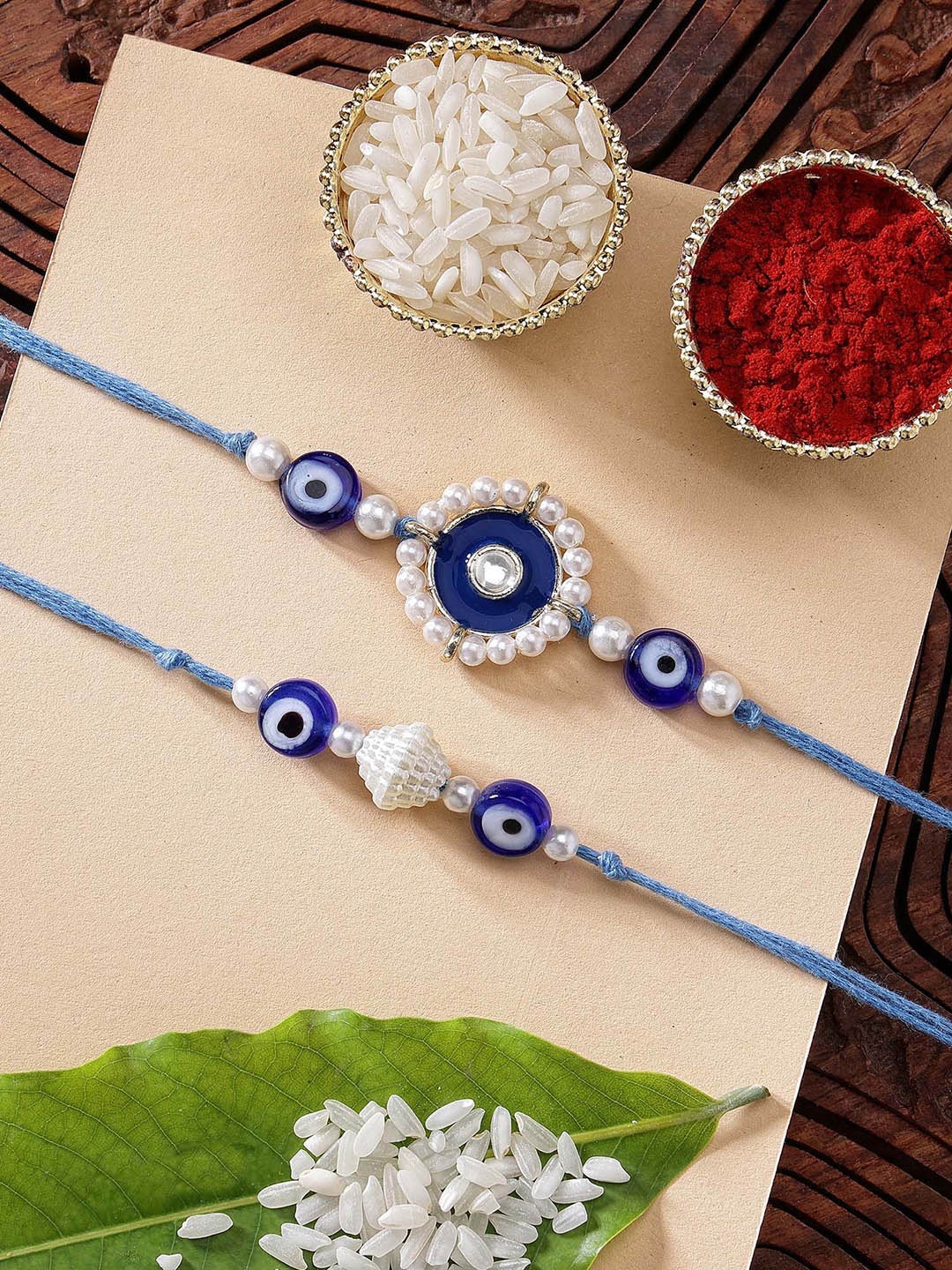 

KARATCART Set of 2 Blue Meena Evil Eye Kundan Rakhi with Roli & Chawal