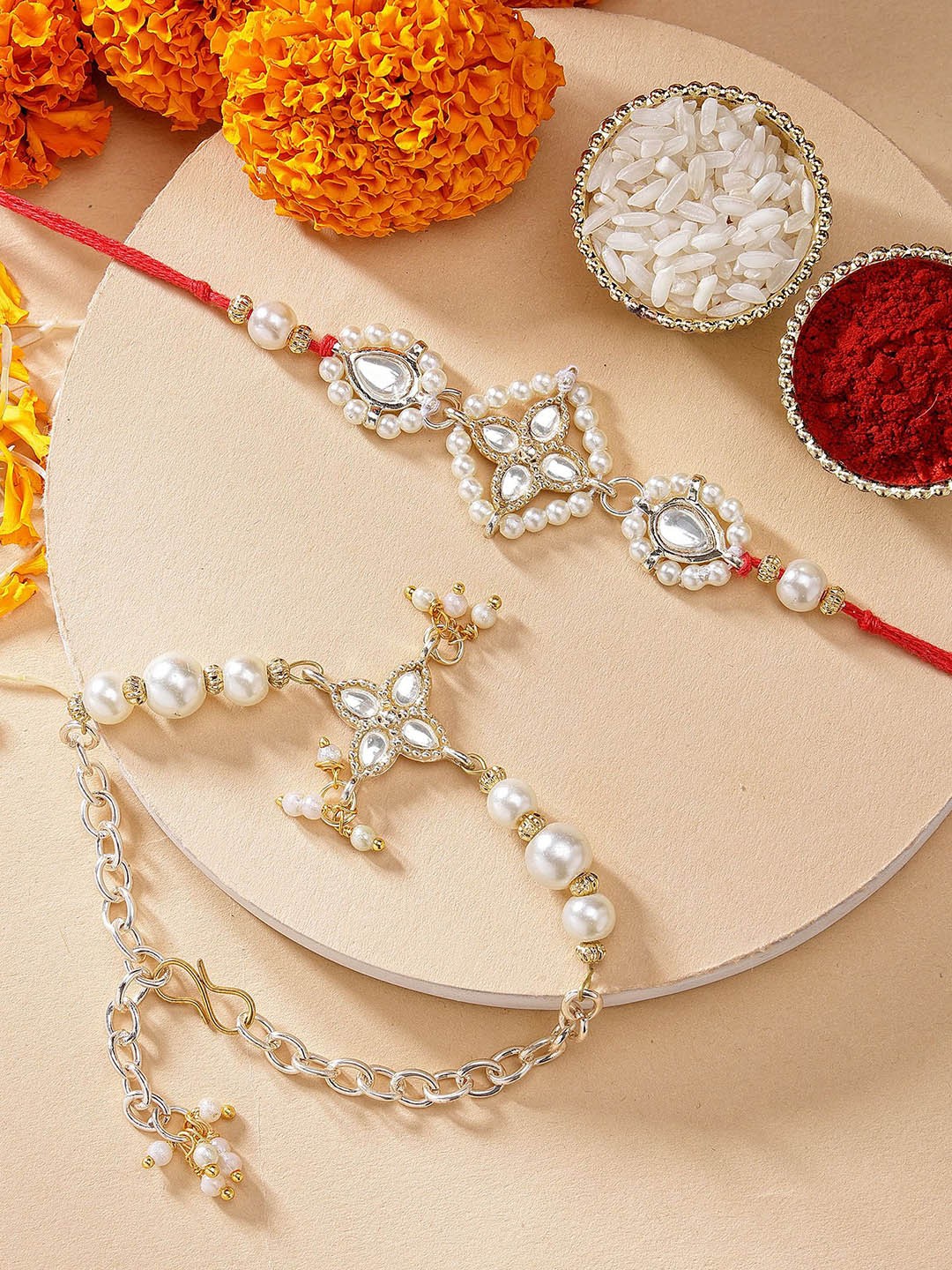 

KARATCART Gold Plated Floral Pearl Kundan Bhaiya Bhabhi Rakhi with Roli & Chawal, Red