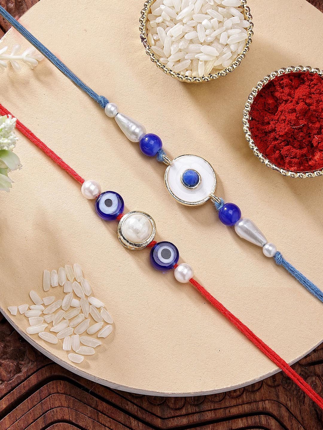 

KARATCART Set of 2 Blue Evil Eye & Pearl Kundan Rakhi with Roli & Chawal