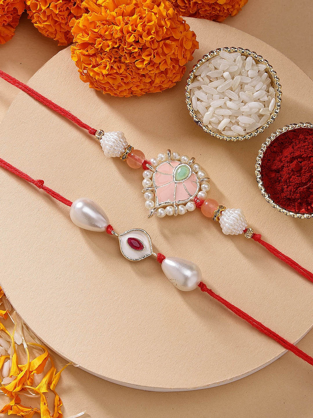 

KARATCART Set of 2 Red Evil Eye Peach Meena Kundan Rakhi with Roli & Chawal, Gold