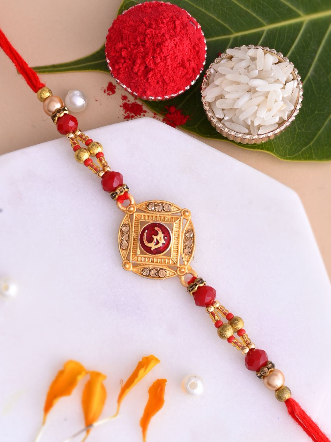 

Aapno Rajasthan Beaded Thread Rakhis with Greetings Card & Roli Chawal, Gold